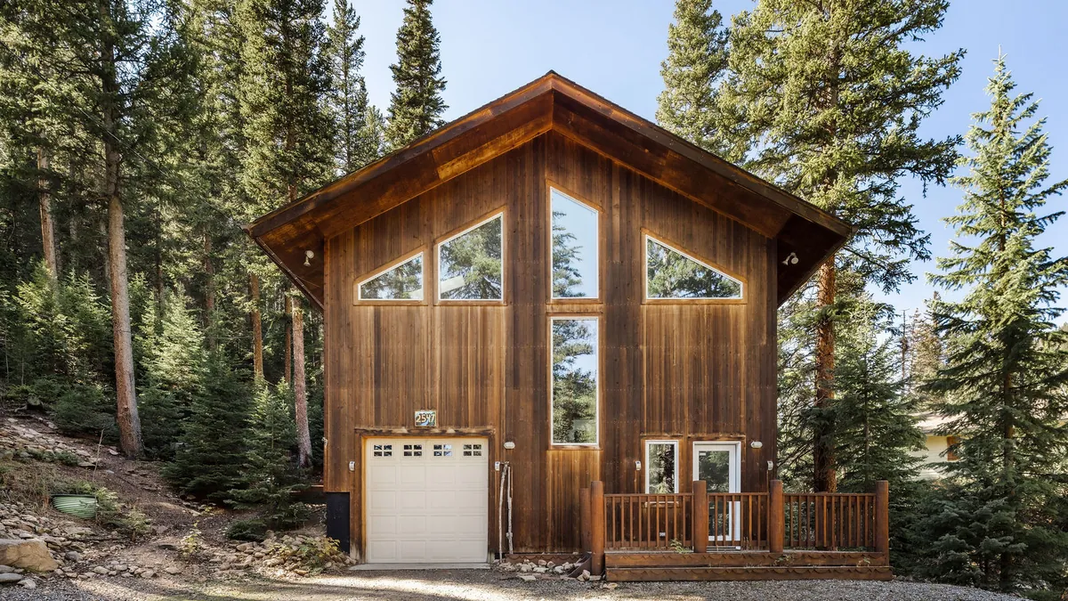 Timber cabin in tall pines at a Colorado mountain rental